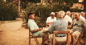 senior citizens sitting around a table