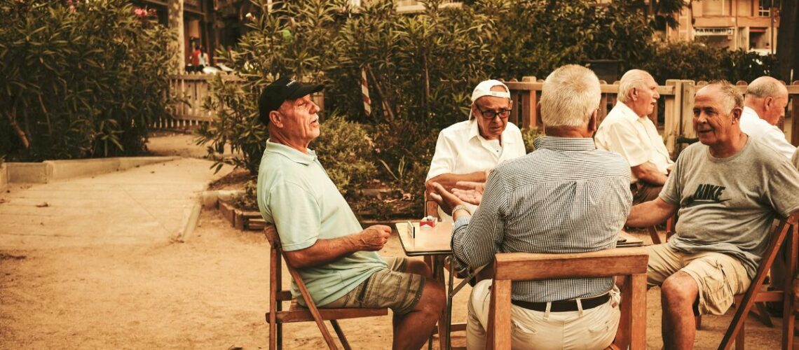 senior citizens sitting around a table